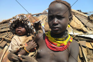 Dassanech Girl Carrying a Baby, Ethiopia - Photo Print 6" x 4"