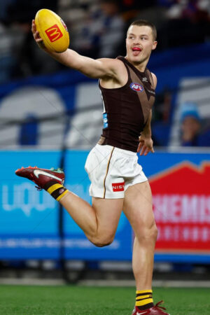 Jack Ginnivan Holding Ball Out Mid-Stride vs Bulldogs 6" x 4" Photo Print