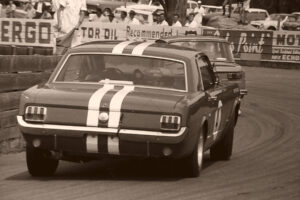 Norm Beechey Mustang Leads Around Bend At Catalina Park 6" x 4" Photo Print