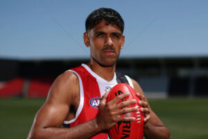 Nasiah Wanganeen-Milera Studio Portrait Holding Red Sherrin 6" x 4" Photo Print