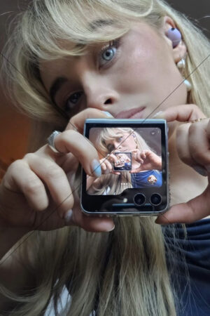 Sabrina Carpenter Close Up Holding Flip Phone Mirror Shot 6" x 4" Photo Print