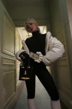 Sabrina Carpenter posing in hallway with face bag 6"x 4" Photo Print