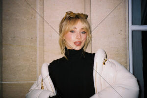 Sabrina Carpenter close-up in white jacket and black turtleneck 6"x 4" Photo Print