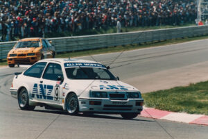 Allan Moffat ANZ Ford Sierra at speed 6" x 4" Photo Print