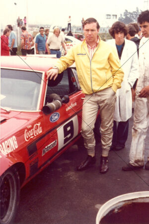 Allan Moffat with red Ford race car 6" x 4" Photo Print