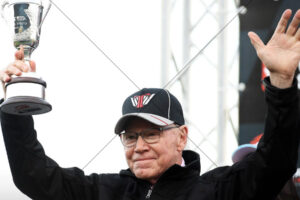Allan Moffat Holding Trophy On Podium 6" x 4" Photo Print
