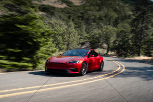 Tesla Model S Cutting Through Forest Bend 6" x 4" Photo Print