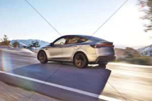 Tesla Model Y Silver Rear On Sunlit Mountain Road 6" x 4" Photo Print