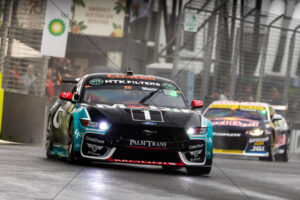 Chaz Mostert Optus Mustang attacking in heavy spray 6" x 4" Photo Print
