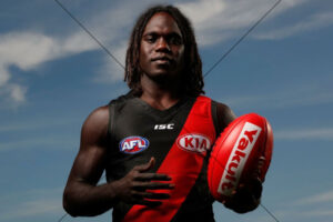 Anthony McDonald-Tipungwuti Holding Red Footy Under Blue Sky 6x4 Photo Print