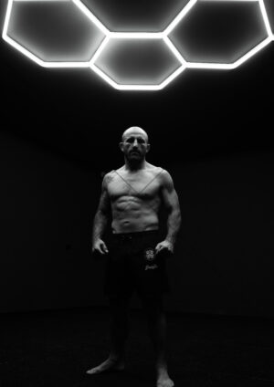 Alexander Volkanovski Full Body Under Hex Lights B-W A4 Poster Print
