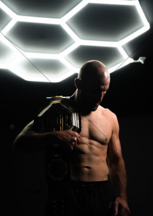 Alexander Volkanovski With UFC Belt Under Hex Lights A4 Poster Print