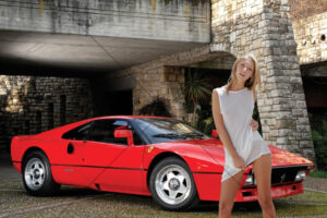 Woman Standing Beside Red Sports Car Outdoors 6x4 Photo Print